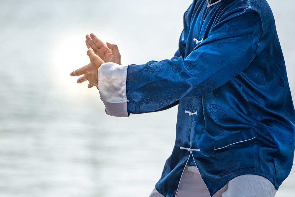 Young man practicing traditional Tai Chi