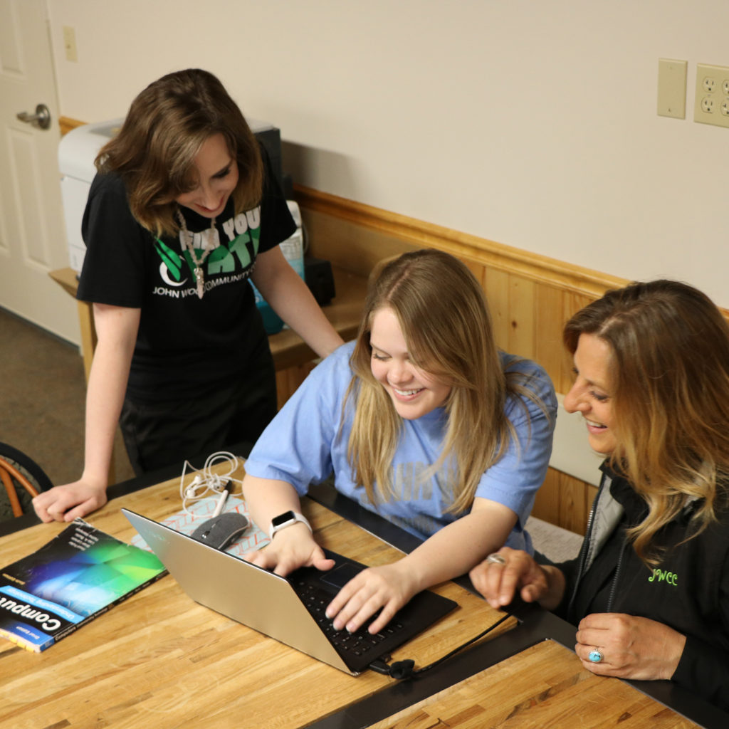 Students working together in the SEC conference room