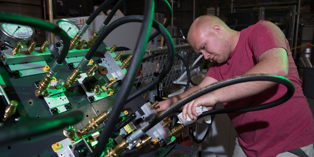 Student working on hydraulics