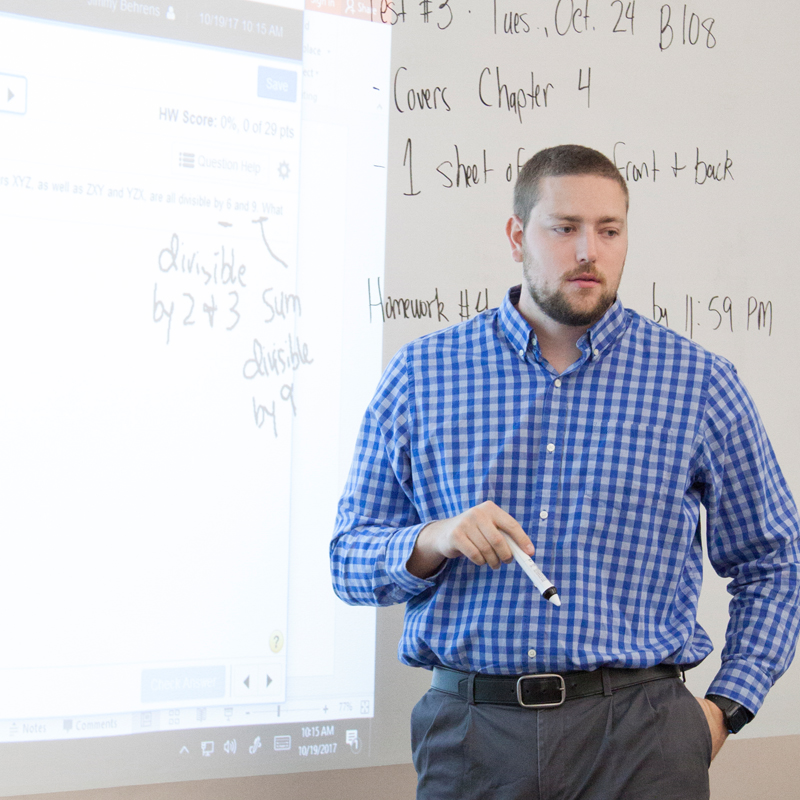 instructor teaching at whiteboard