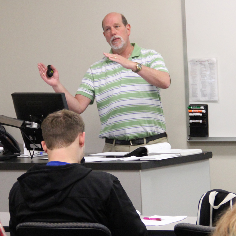 male professor teaching class