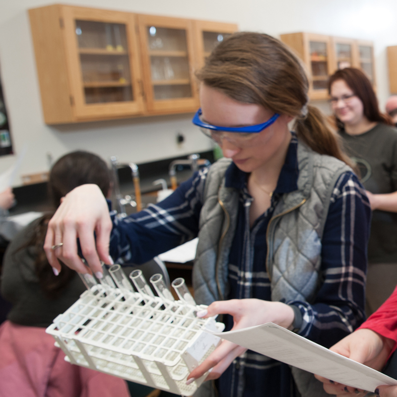 Student wearing safety glasses in chemistry class