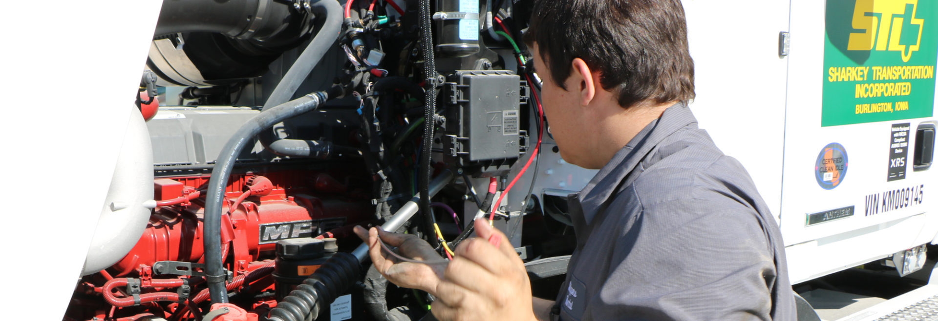 student working on a diesel