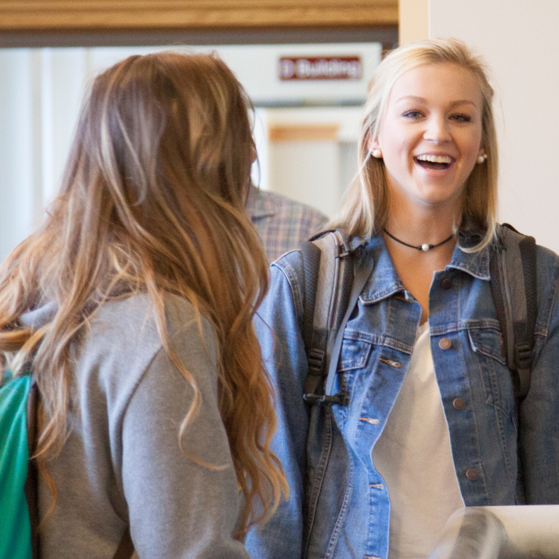 two students in the hallway