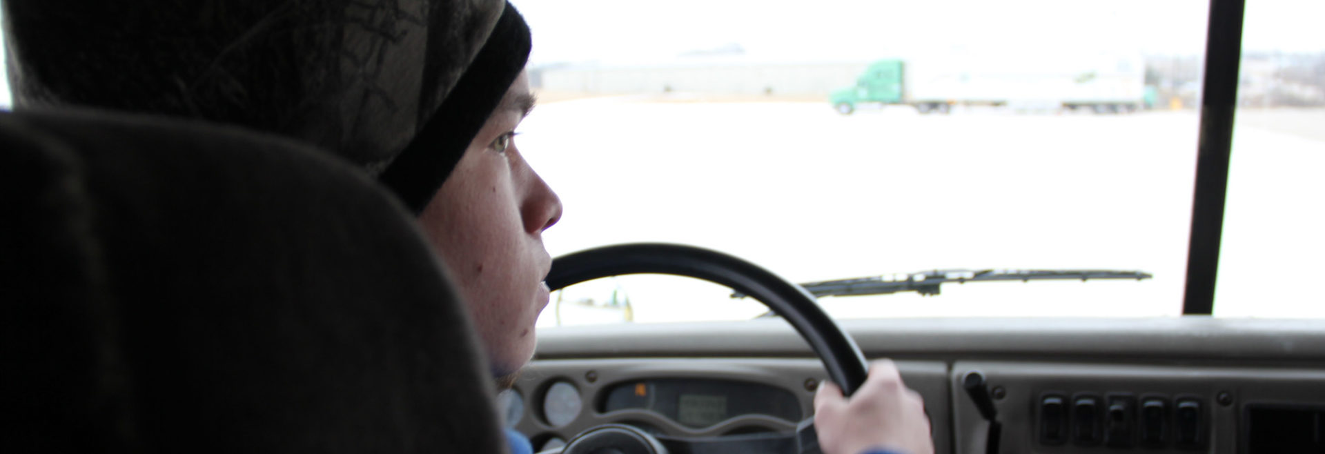 student driving a truck