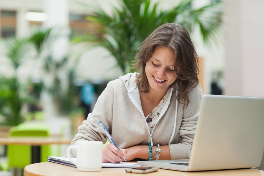 female student working on laptop