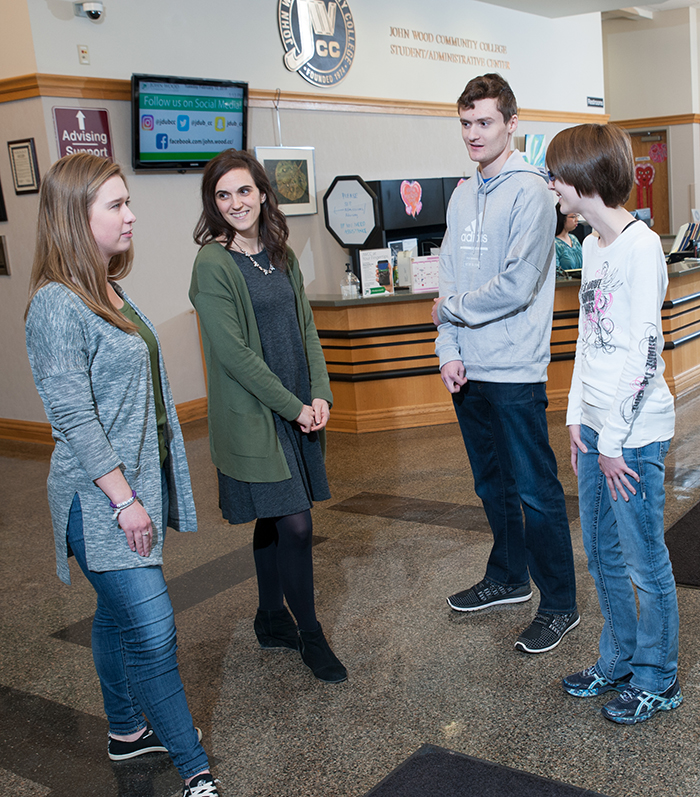 Admissions director with students