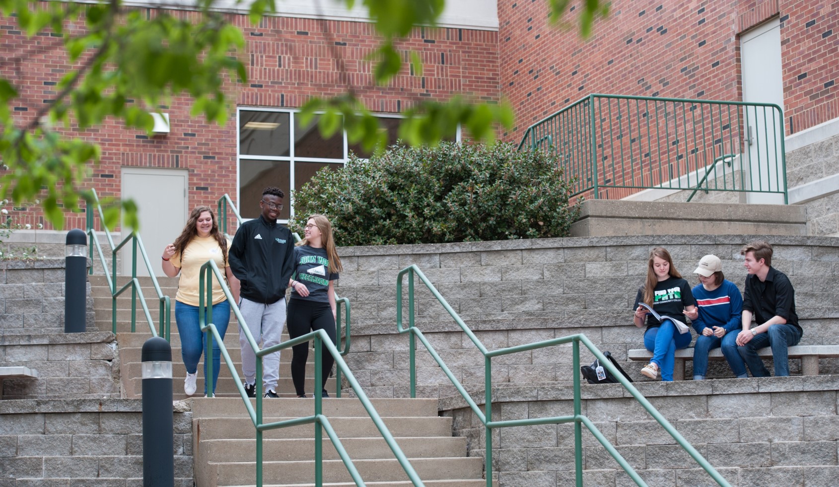 JWCC students walk down outside stairs on main campus