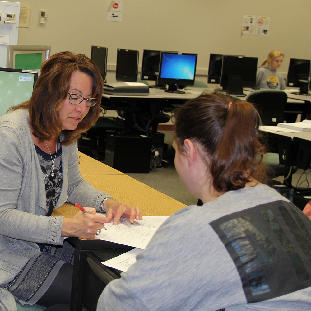 instructor talking with a student