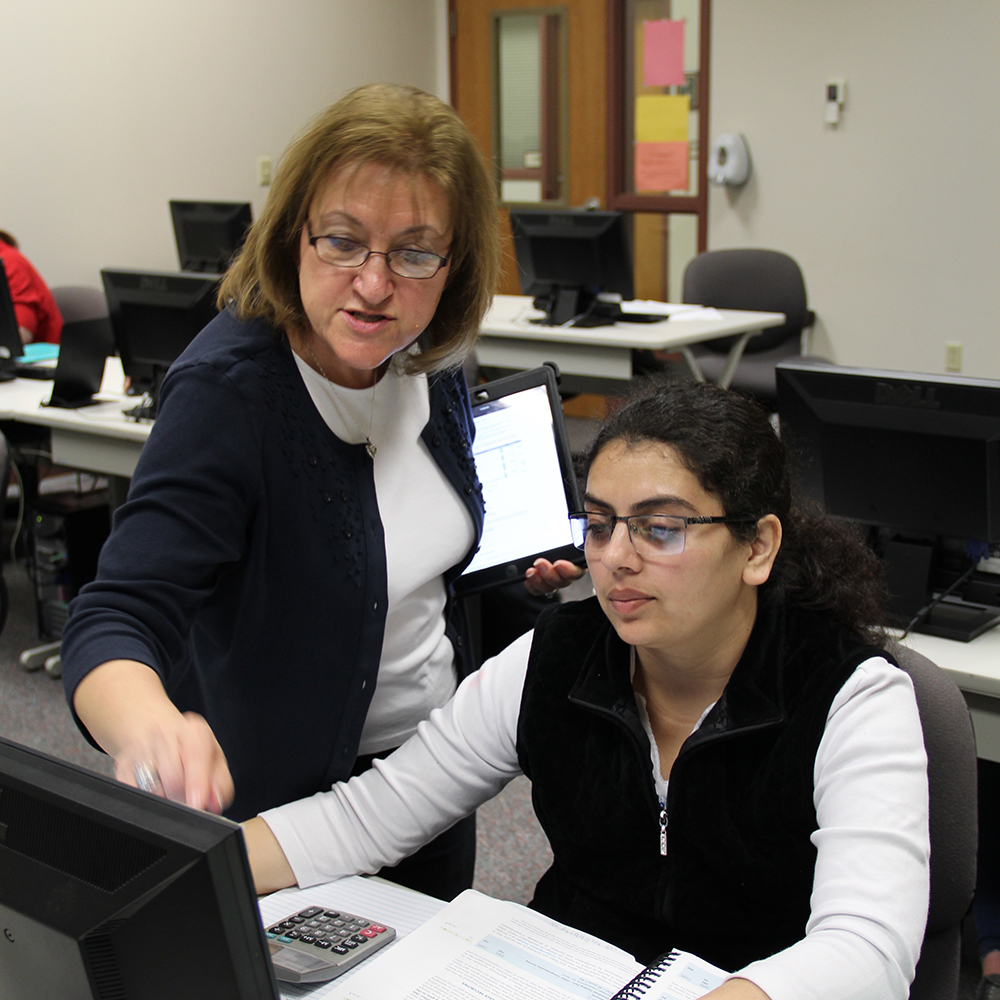 instructor helping student