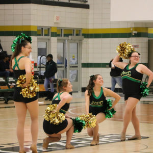 JWCC Blazerettes dancing at a basketball game