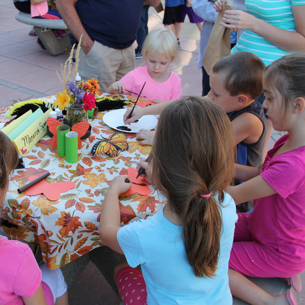 Children creating art with markers and paint