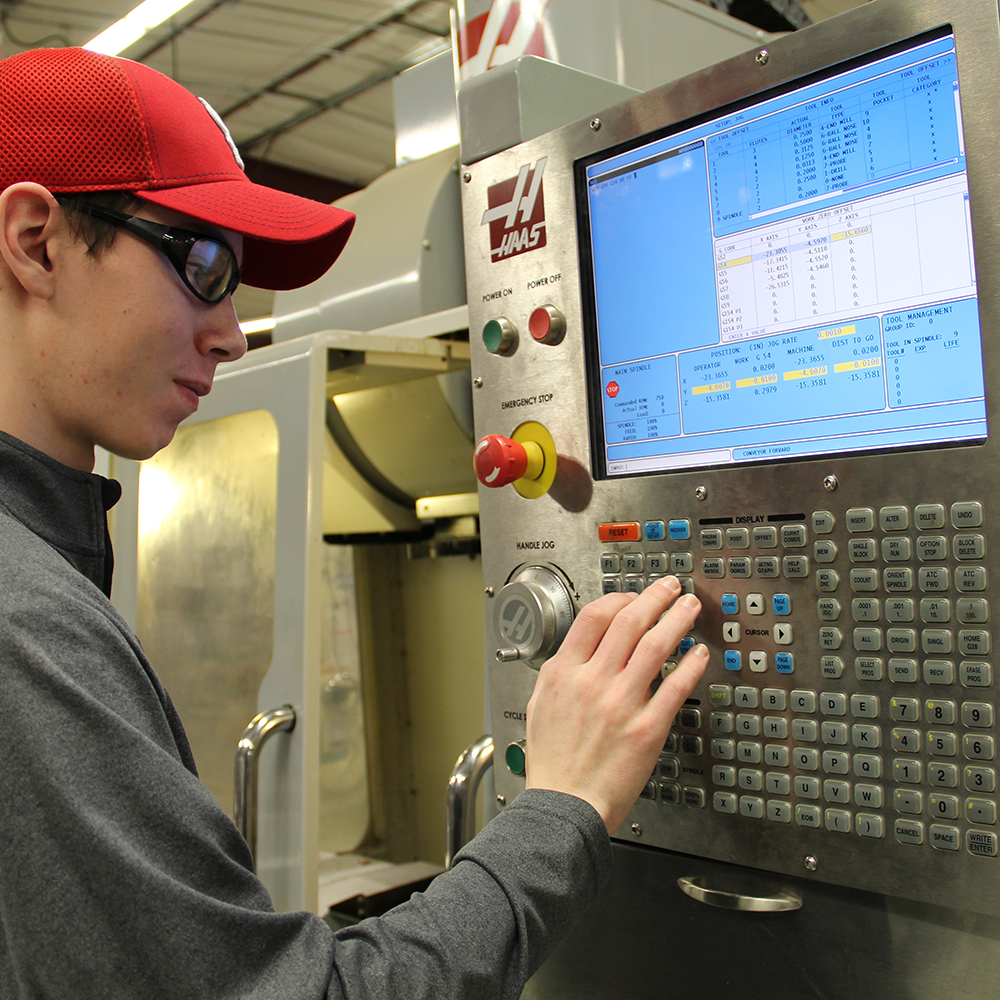 Man with hat working manufacturing technology