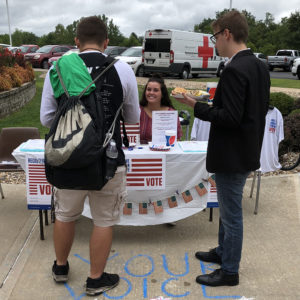 Students meet at the College Republicans booth at a Blazer BBQ