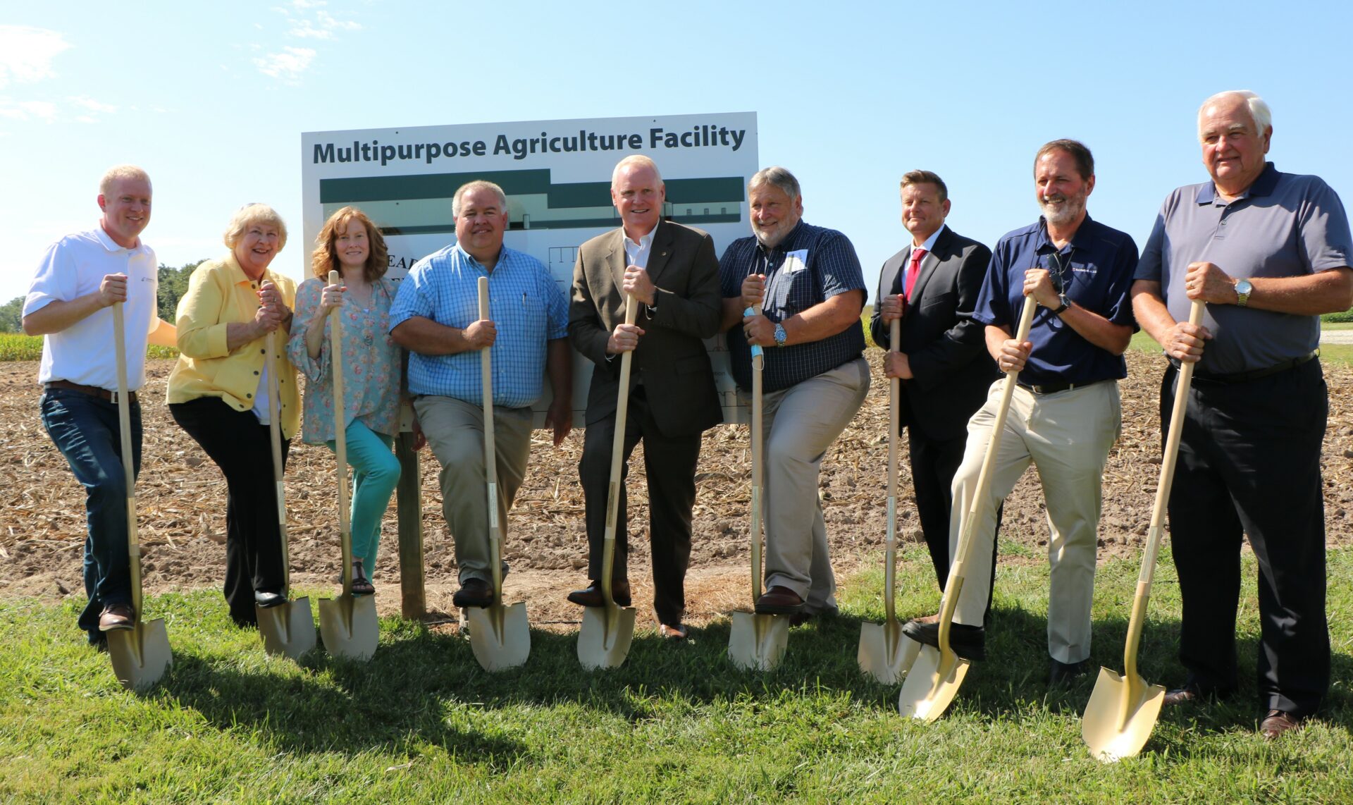 Several JWCC trustees pose with shovels in new Orr Building groundbreaking session