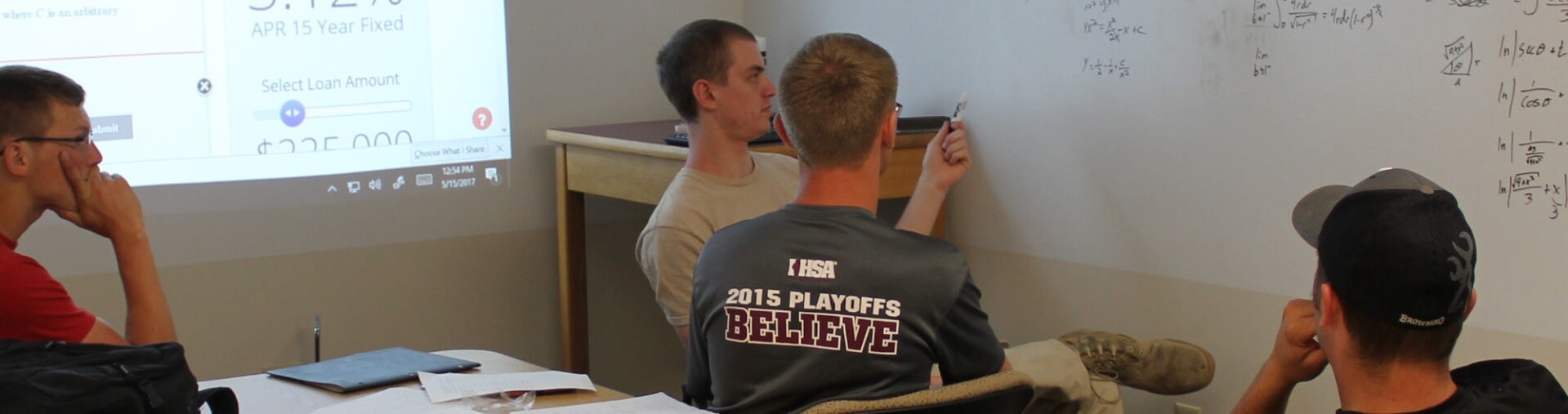 Multiple engineering students discuss difficult calculus problem