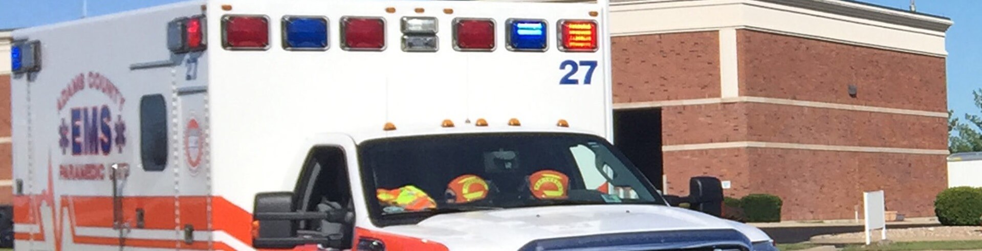 Adams County ambulance parked in front of John Wood Community College