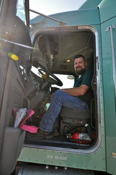 Luke Lish, sitting in the cab of his truck.
