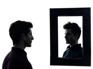 Man looking in a mirror