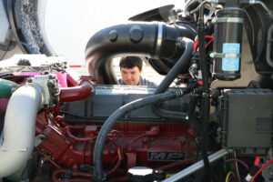 A student working on an engine.