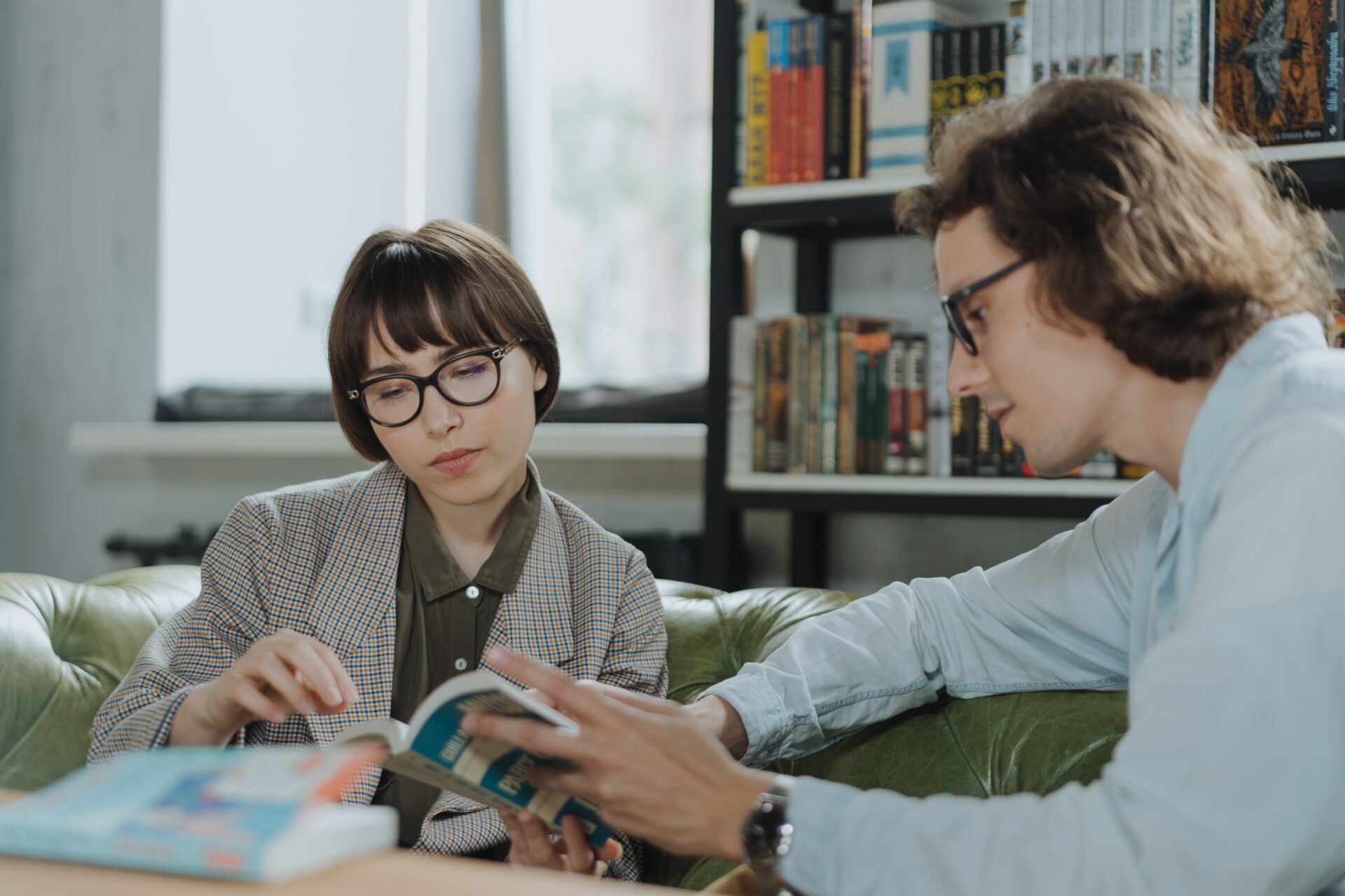 A tutor helping someone learn to read