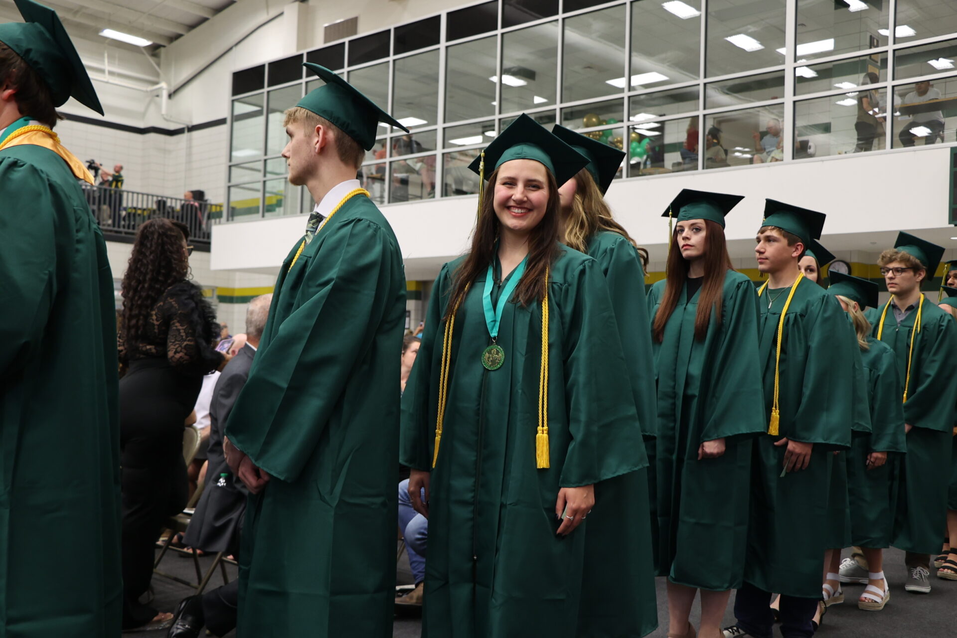 Girl smiling in graduation line