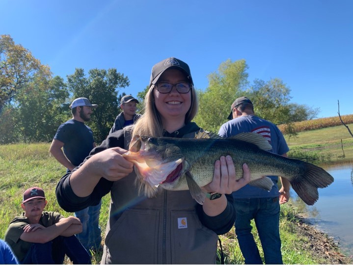 Student poses with large fish