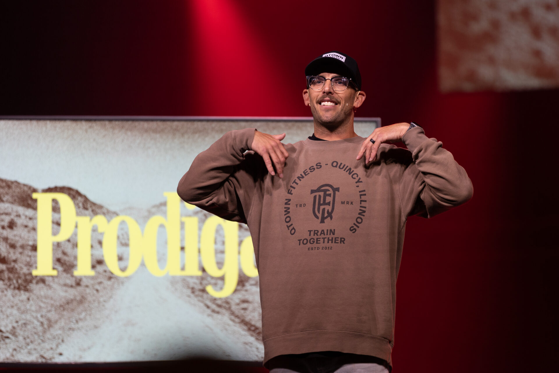 Photo of Kory Hollensteiner Preaching at the Crossing Church