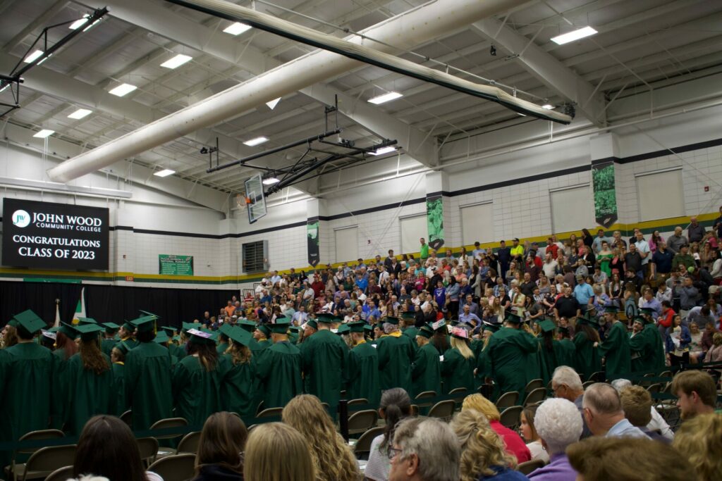 Graduates of 2023 stand for their ceremony