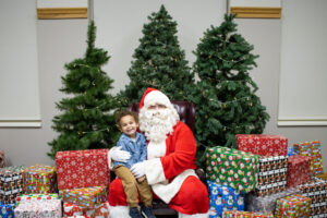 Photo of Santa with child.