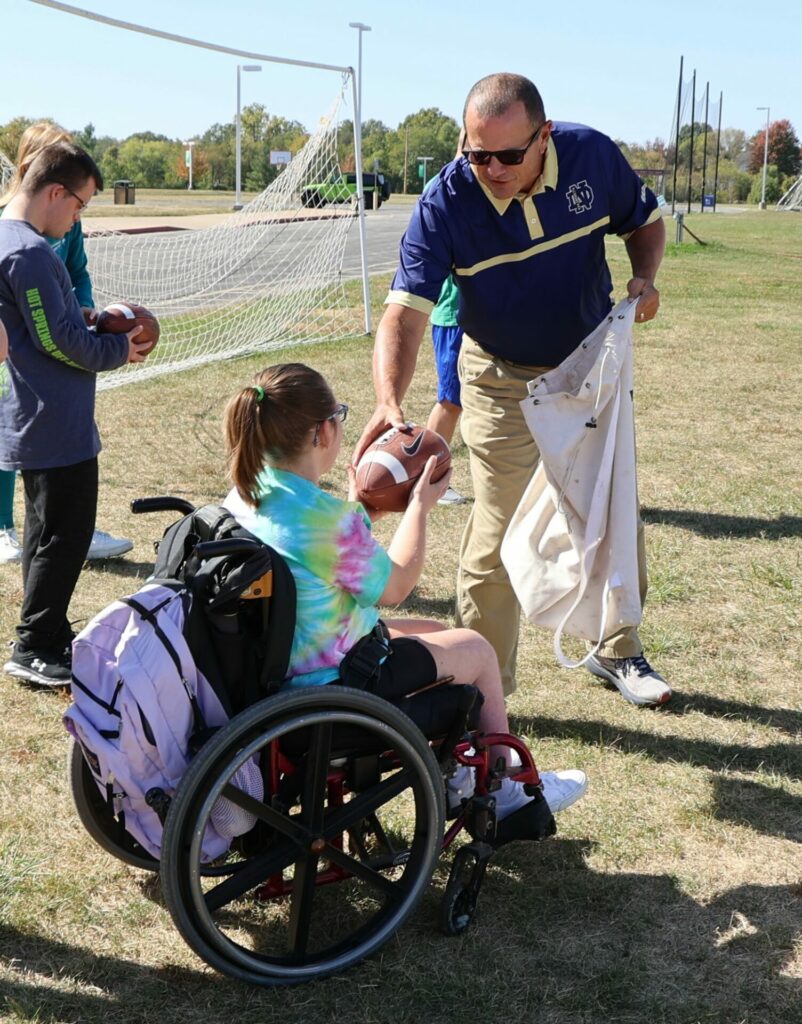 College for Life student receives football directions