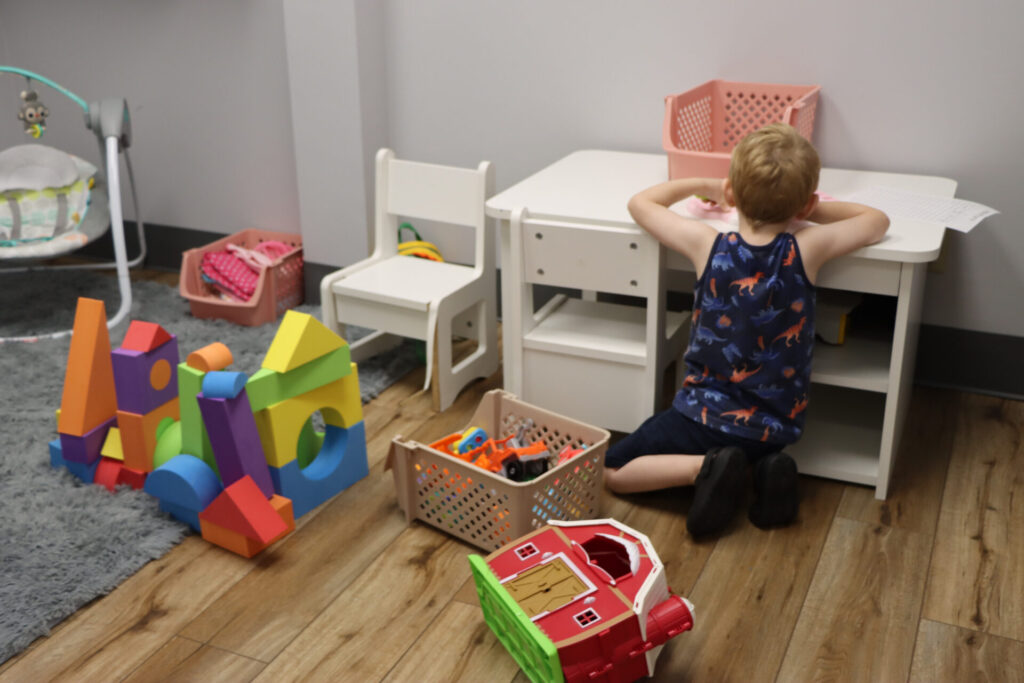 bella-ease-children-indoors Child plays with toys inside Bella Ease center