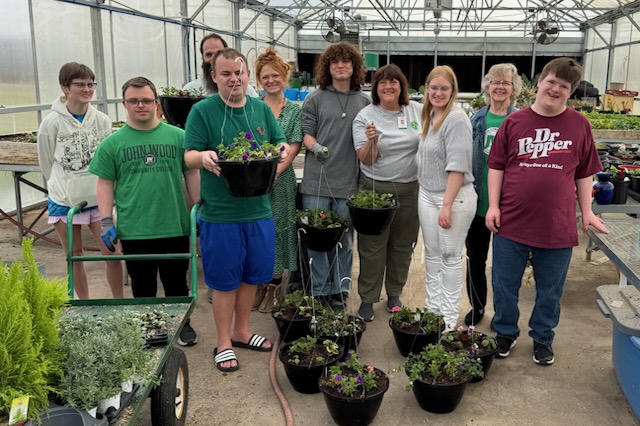 cfl-garden College for Life students working in the JWCC greenhouse