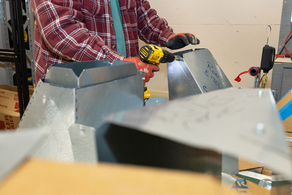 Student working on an HVAC unit
