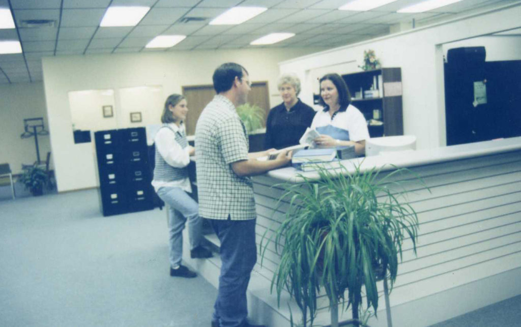 Early picture of the Pittsfield Education Center front desk